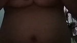 Squeezing the breasts after showering