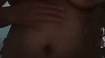 Squeezing the breasts after showering