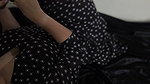 wearing a beautiful dress, masturbating while showing off her vagina