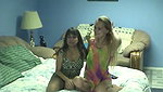 Horny lesbian chicks strip in bed and lick tits