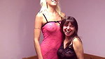 Platinum blonde spreads her legs so brunette can shove dildo up her cunt