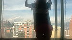 Dancing at the window in full view of the neighbors