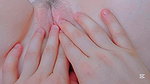 moistening her petite pussy and penetrating it with lubricant