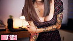 Naughty Colombian girl with a spectacular tattooed body and an angelic face wears a beautiful dress