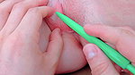 opening her pussy with a pen inside and tight