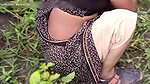 The desi daughter-in-law of the village is taking off her clothes in the millet field and showing her finger in her pussy to her father-in-law