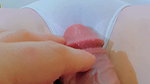 Rubbing her innocent cunt, she opens her lips