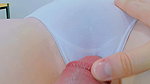Rubbing her innocent cunt, she opens her lips