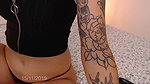 Sexy slim Latina with tattooed body and innocent girl face