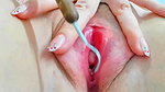 squeezing fluid from inside her pink pussy