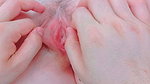 stretching the pink lips attached to her pussy