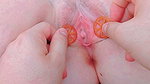 stretching the tight, sticky lips of her pussy