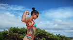 Push ups and chest flex on the beach