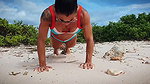 Push ups and chest flex on the beach