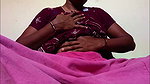 Ammu takes off her nightie and, left in just her undergarments, squeezes her breasts 129