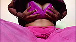 Ammu takes off her nightie and, left in just her undergarments, squeezes her breasts 129