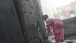 my maid taking shower at backyard