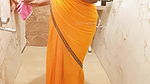 Indian maid bathing in saree