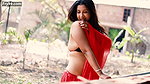 Nandita Showing Deep Cleavage and Navel in Low Waist Red Saree