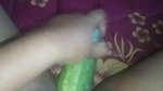 Busty slut inserts cucumber in her cunt