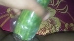 Busty slut inserts cucumber in her cunt