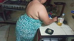 chubby stepmother in the kitchen preparing a delicious dinner