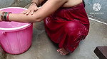 Indian housewife bathing with