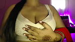 Hot desi girl massaged her breasts and pressed her breasts and sucked the nipples in her mouth