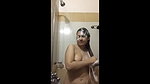 a cute bubbly beauty bathing in shower