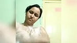 In bathroom, bathing