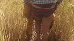 Desi daughter-in-law is walking in the wheat field in front of her father-in-law with her big ass and fingering her pussy