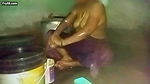 Indian aunty bathing in village home