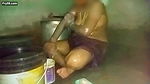 Indian aunty bathing in village home