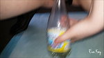 a kay Peeing in a bottle