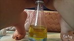 a kay Peeing in a bottle