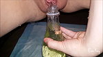 a kay Peeing in a bottle