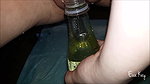 a kay Peeing in a bottle