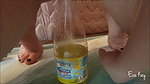 a kay Peeing in a bottle