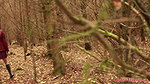 she is walking through the woods and pees with her