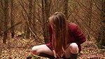 she is walking through the woods and pees with her