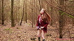 she is walking through the woods and pees with her