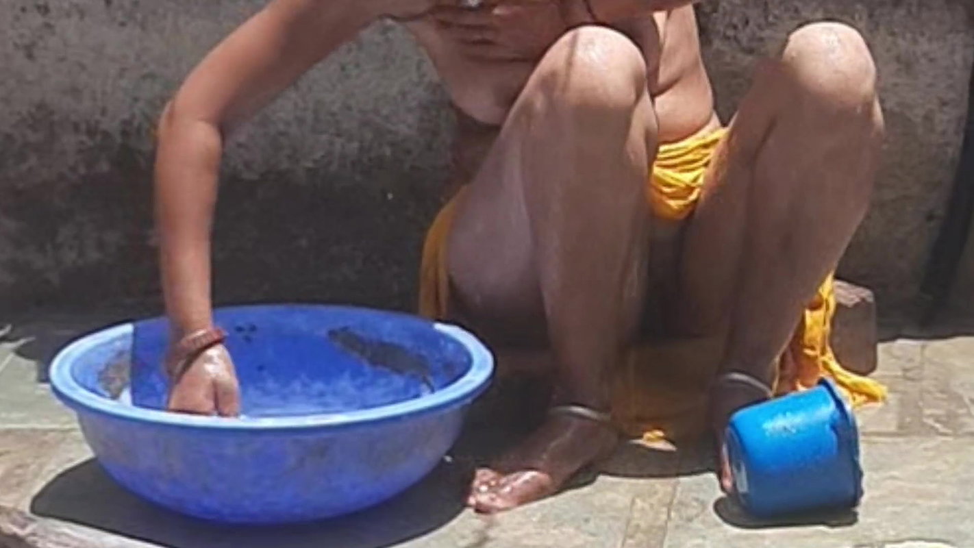 Desi stepsister is taking a bath in the open bathroom, undressing and showing beautiful head body, stepbrother is seen bathing stepbrother in the open bathroom