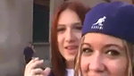 Elizabeth Douglas and Trisha Annabelle smoking in the street