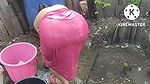 Indian house wife bathing outside