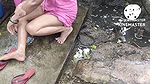 Indian house wife bathing outside