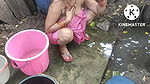 Indian house wife bathing outside