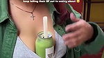 Sexy girl boobs enjoyed by boyfriend drinking juice