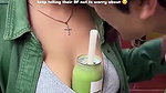 Sexy girl boobs enjoyed by boyfriend drinking juice