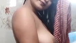 Beautiful girl topless after head shower-bath