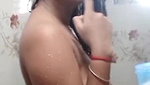 Beautiful girl topless after head shower-bath